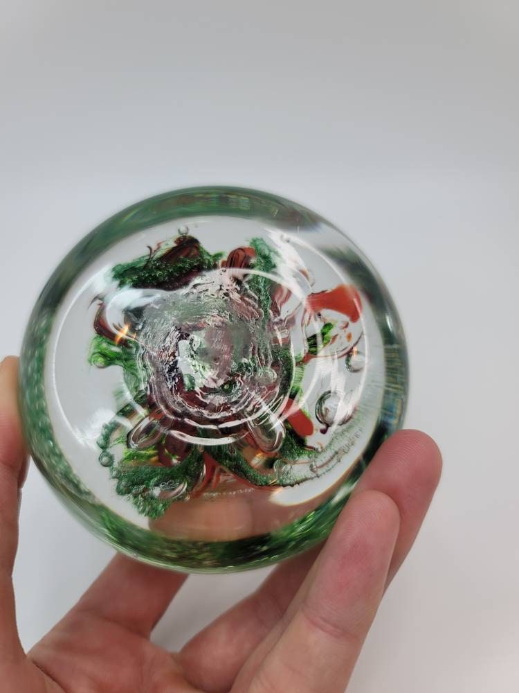 Red and sparkle green paper weight
