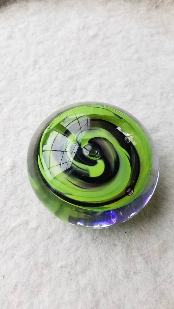 Green and purple paper weight