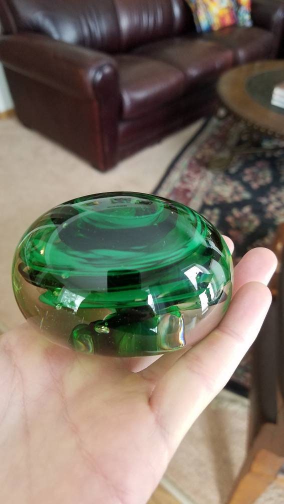 Black and green paper weight