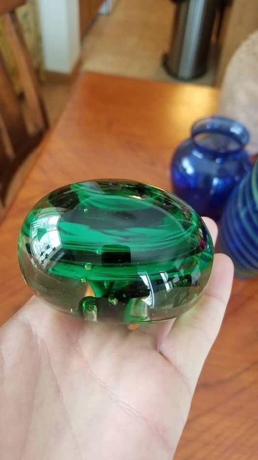 Black and green paper weight