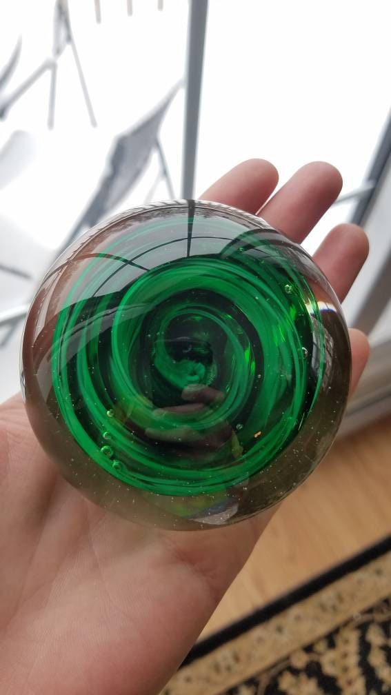 Black and green paper weight