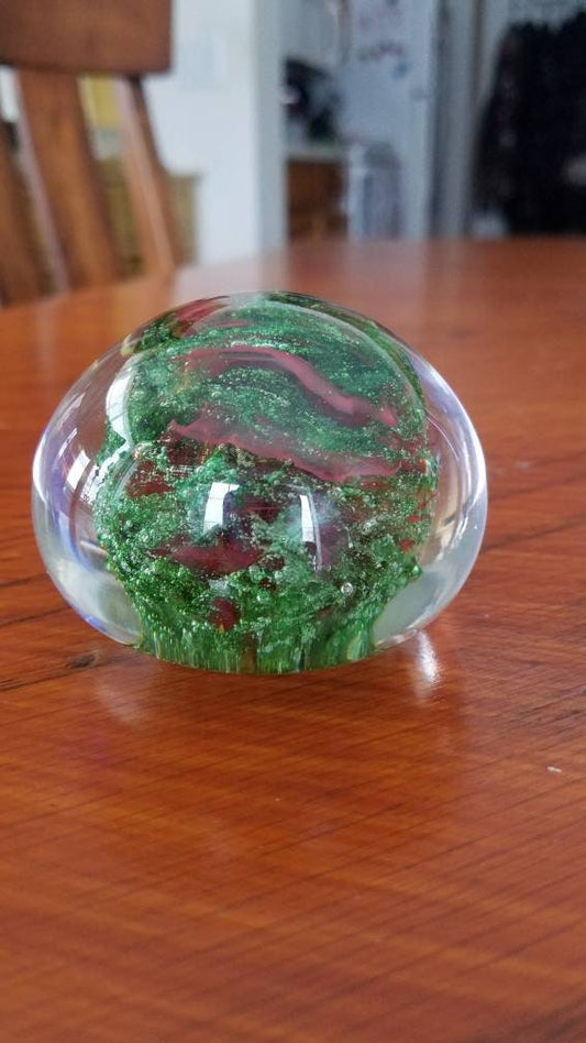 Red and sparkle green paper weight