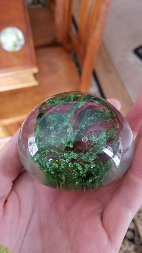 Red and sparkle green paper weight