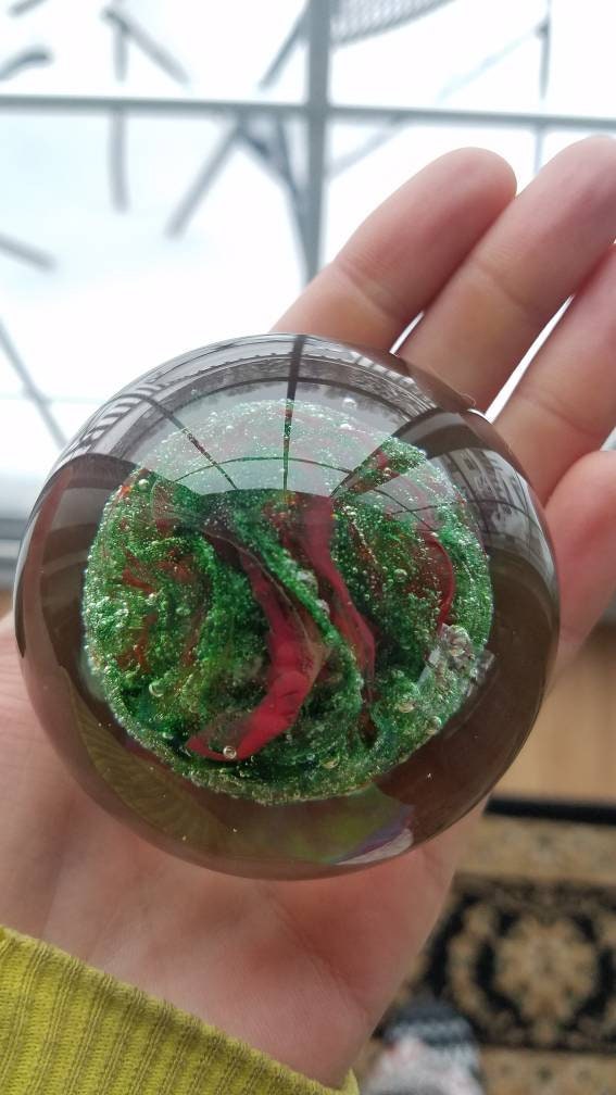 Red and sparkle green paper weight