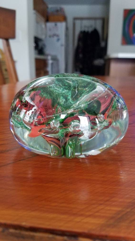 Red and sparkle green paper weight