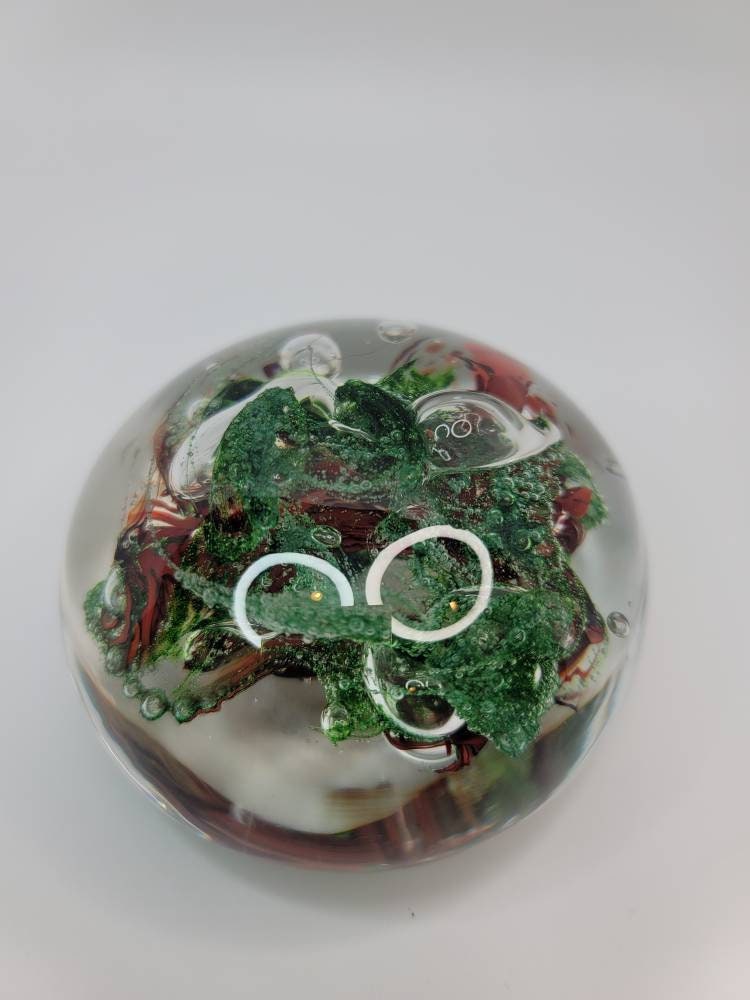 Red and sparkle green paper weight