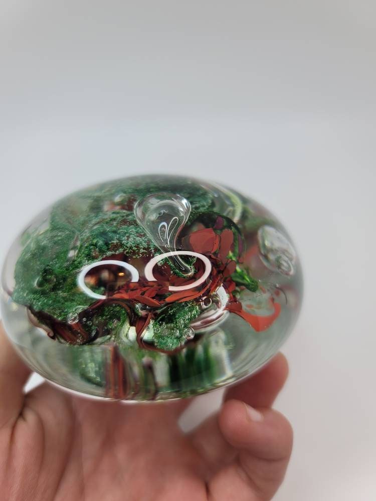 Red and sparkle green paper weight