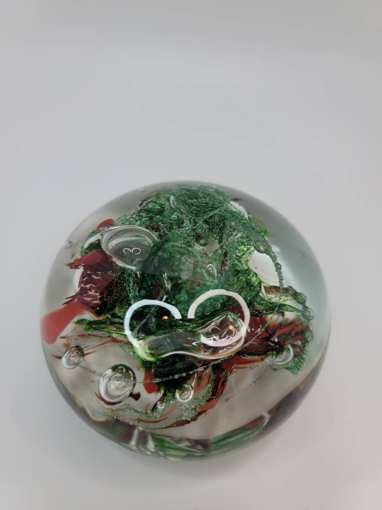 Red and sparkle green paper weight