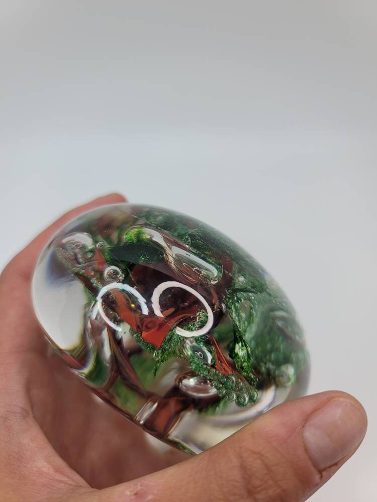 Red and sparkle green paper weight